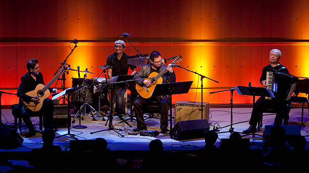 Two guitarists, an accordion player and percussionist play arrangements of and improvise on Takemitsu's film scores
